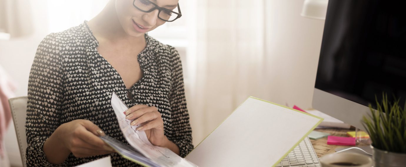 Woman browsing a ring binder