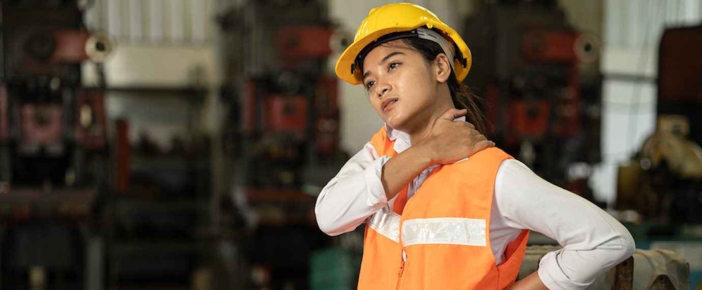 Tired stress women worker neck pain working in heavy industry factory, health problem asian labor concept.