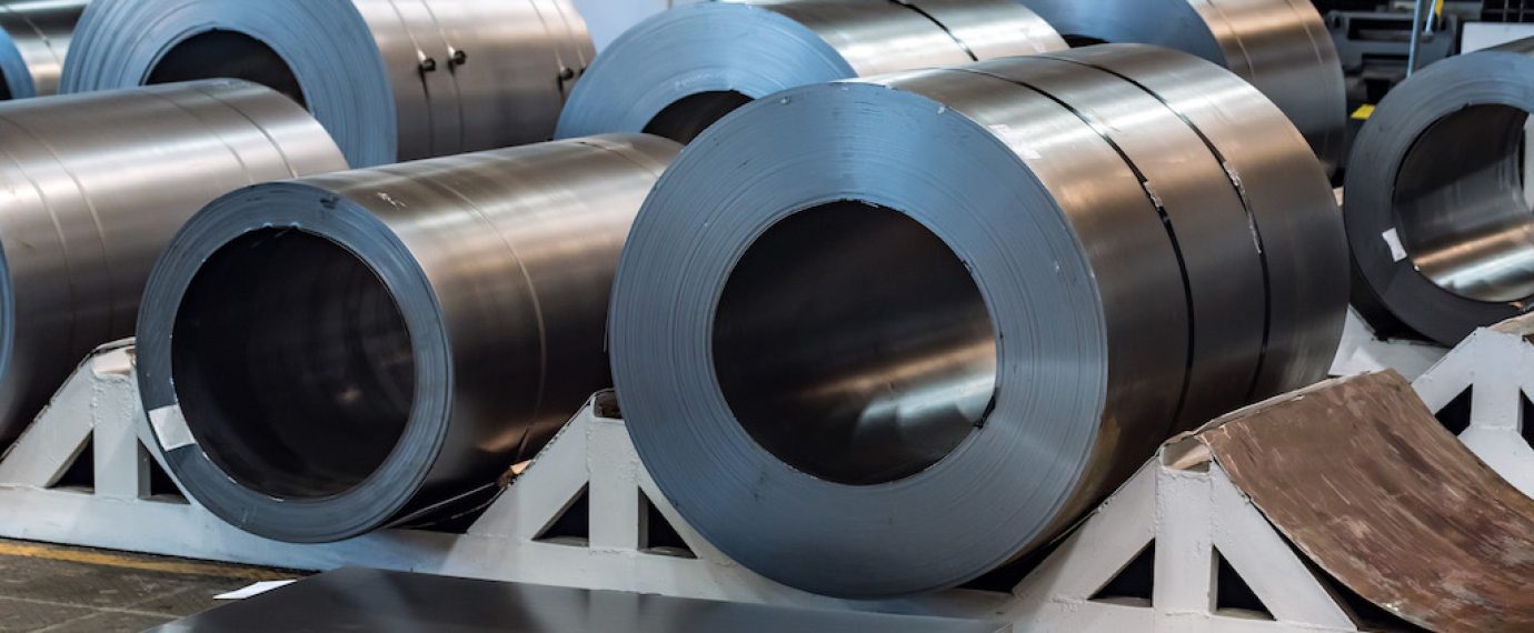 Warehouse with rolls of sheet steel in industrial plant. Hardware manufacturing